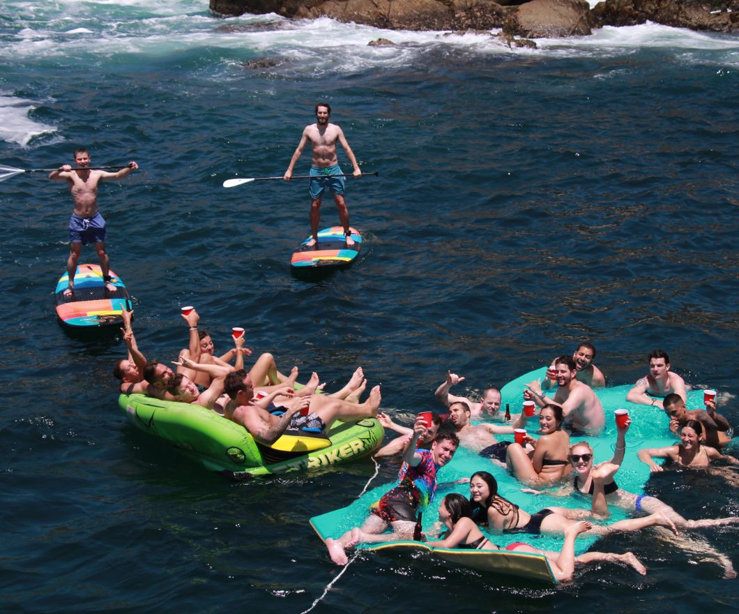 group partying on tubes and lily pads