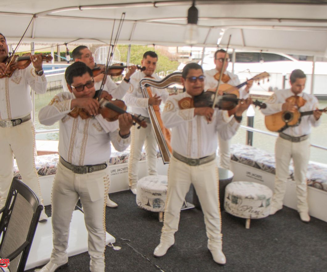 mariachi band playing on private boat party